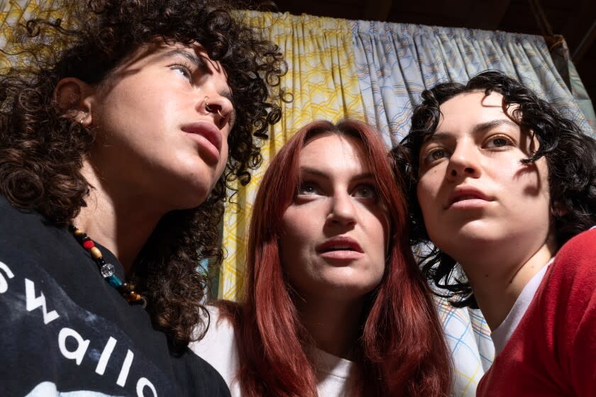 Los Angeles, CA: July 15, 2022: L.A. pop trio MUNA, USC college friends-turned-queer idols, who got a new lease on life after leaving RCA and signing to Phoebe Bridgers' label Saddest Factory. The band is comprised of Katie Gavin, Josette Maskin, and Naomi McPherson. All members use they/them pronouns. Their indie label debut, MUNA, has just dropped, enjoying much fanfare in the final days of Pride Month. (CREDIT: Emily Monforte / For The Times)