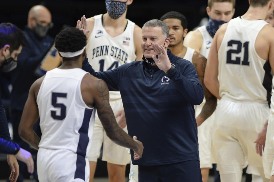 Penn State's coach Penn State coach Jim Ferry approaches Jamari Wheeler (5) during a time out in the second half of an NCAA college basketball game, Saturday, Jan. 30, 2021, in State College, Pa. (AP Photo/Gary M. Baranec)