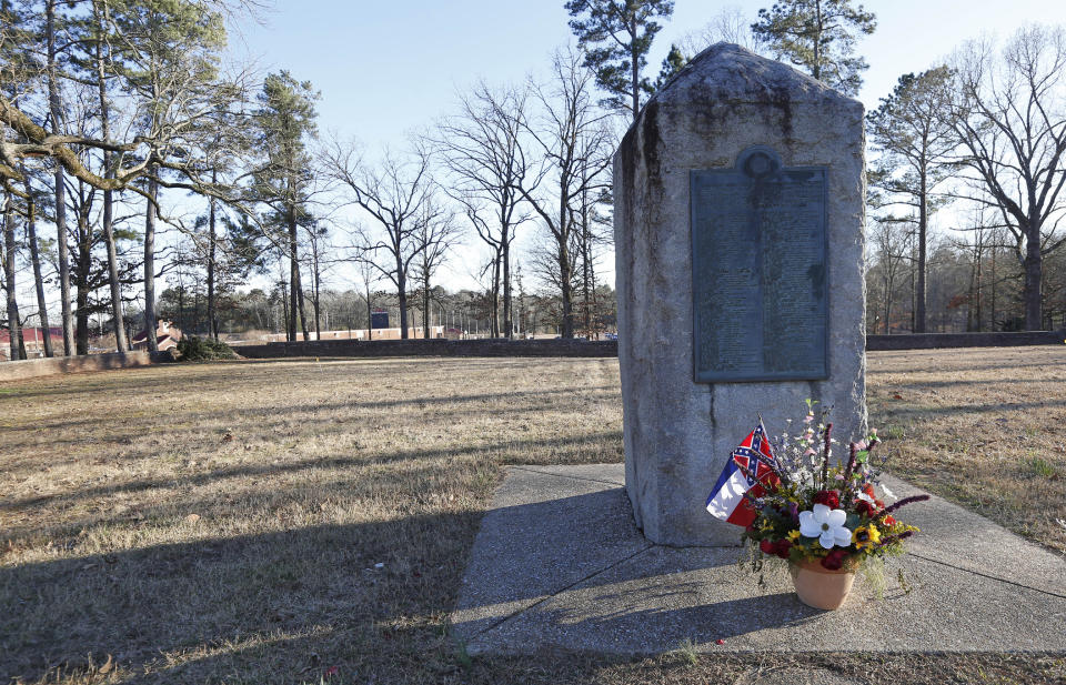 File-This March 5, 2019, file photo shows a memorial marker standing in the University of Mississippi campus cemetery that has the graves of Confederate soldiers killed at the Battle of Shiloh. The University of Mississippi's leader says he agrees that a Confederate monument should be shifted from its current spot on campus. Interim Chancellor Larry Sparks said in a Thursday, March 21, 2019, statement that he is consulting with historic preservation officials on relocating the statue. (AP Photo/Rogelio V. Solis, File)