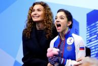 Apr 2, 2016; Boston, MA, USA; Evgenia Medvedeva of Russia reacts with her coach as she sees her scores after her gold medal performance in the ladies free skate at the ISU World Figure Skating Championships at TD Garden. Mandatory Credit: Winslow Townson-USA TODAY Sports