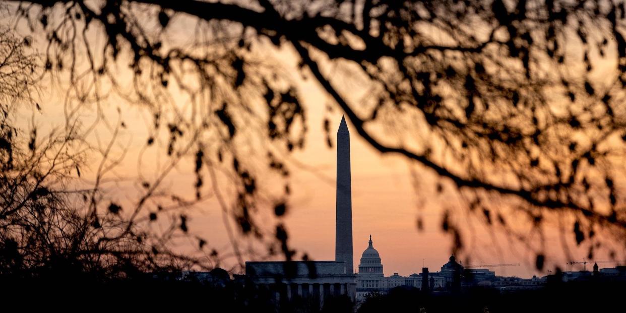 The Lincoln Memorial, Washington Monument, and US Capitol at sunrise in Washington, DC, on January 16, 2022, ahead of a winter storm