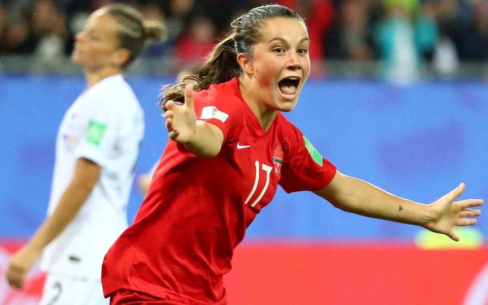 Jessie Fleming reels away in celebration after scoring for Canada in Grenoble on Saturday night - REUTERS