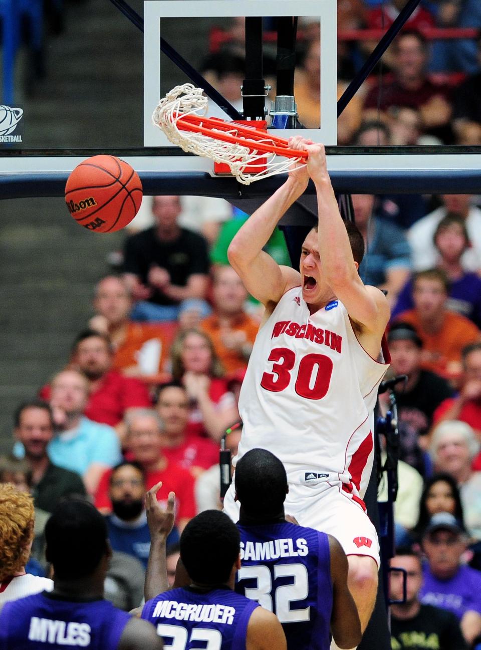 Mar 19, 2011; Tucson, AZ, USA; Wisconsin Badgers forward Jon Leuer (30) dunks the ball against the Kansas State Wildcats during the third round of the 2011 NCAA men’s basketball tournament at the McKale Center. The Badgers defeated the Wildcats 70-65. Mandatory Credit: Jennifer Stewart-USA TODAY Sports