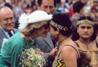 <p>Princess Diana greets a Māori woman with a traditional hongi nose rub at Auckland's Eden Park Stadium.</p>