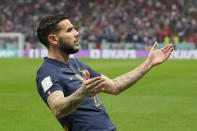 France's Theo Hernandez , celebrates after scoring the opening goal during the World Cup semifinal soccer match between France and Morocco at the Al Bayt Stadium in Al Khor, Qatar, Wednesday, Dec. 14, 2022. (AP Photo/Christophe Ena)