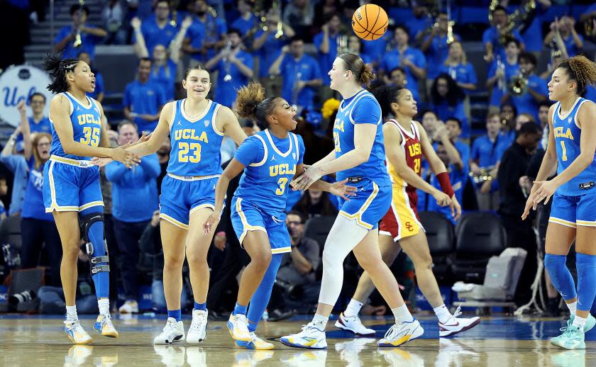 LOS ANGELES-CA-DECEMBER 30, 2023: UCLA Women's basketball team celebrates their win over USC.