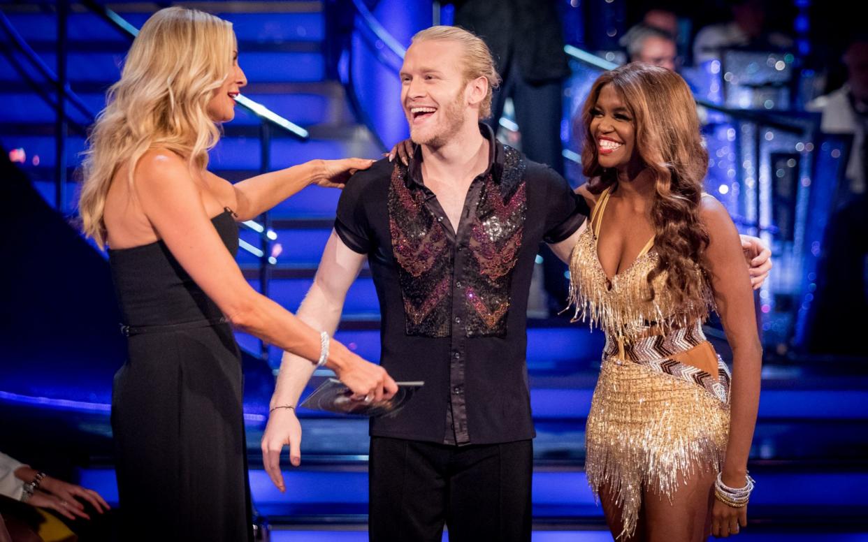 Paralympic athlete Jonnie Peacock and partner Oti Mabuse chat to Tess Daly. - WARNING: Use of this copyright image is subject to the terms of use of BBC Pictures' Digital Picture