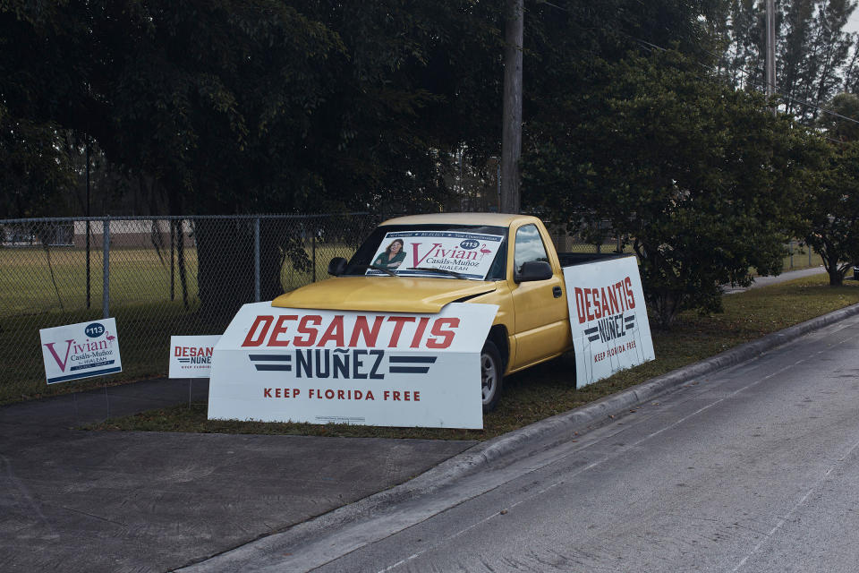 Signs for Governor Ron DeSantis are seen near a polling site at the John F. Kennedy Library in Hialeah, Florida, Nov. 8, 2022.<span class="copyright">Andres Kudacki for TIME</span>