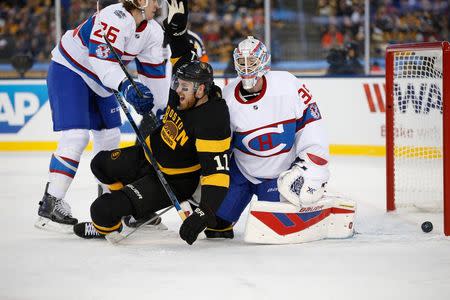 Jan 1, 2016; Foxborough, MA, USA; Boston Bruins right wing Jimmy Hayes (11) celebrates in front of Montreal Canadiens goalie Mike Condon (39) after a goal by Boston Bruins left wing Matt Beleskey (not shown) in the Winter Classic hockey game at Gillette Stadium. Mandatory Credit: Greg M. Cooper-USA TODAY Sports