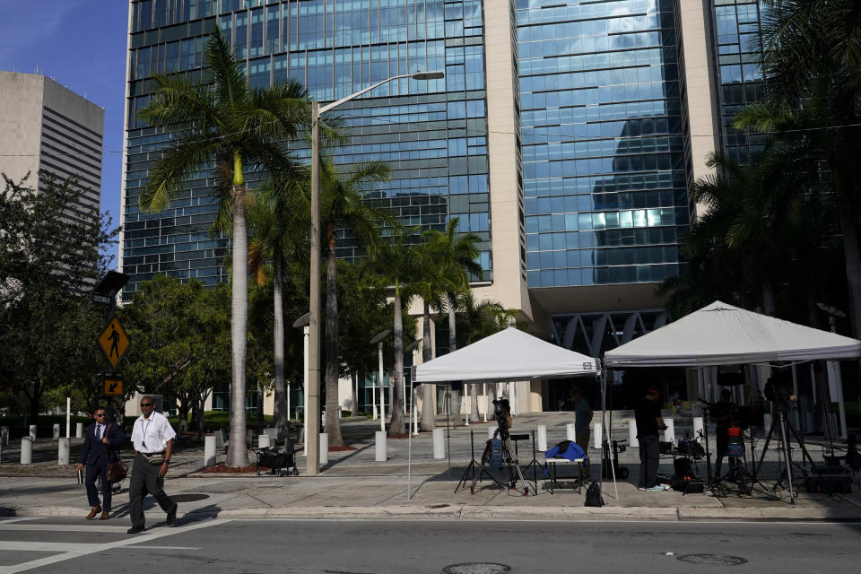 News media are set up outside of the Wilkie D. Ferguson Jr. U.S. Courthouse where a grand jury is meeting, Wednesday, June 7, 2023, in Miami. Federal prosecutors are using a grand jury in Florida as part of an investigation into the possible mishandling of classified documents at former President Donald Trump's Palm Beach property, a personal familiar with the matter told The Associated Press. (AP Photo/Lynne Sladky)