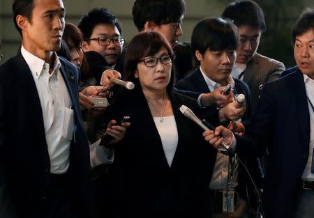 Japan's Defense Minister Tomomi Inada (C) is surrounded by reporters after reports of the launch of a North Korean missile, upon her arrival at Prime Minister Shinzo Abe's official residence in Tokyo, Japan May 14, 2017. REUTERS/Toru Hanai/Files