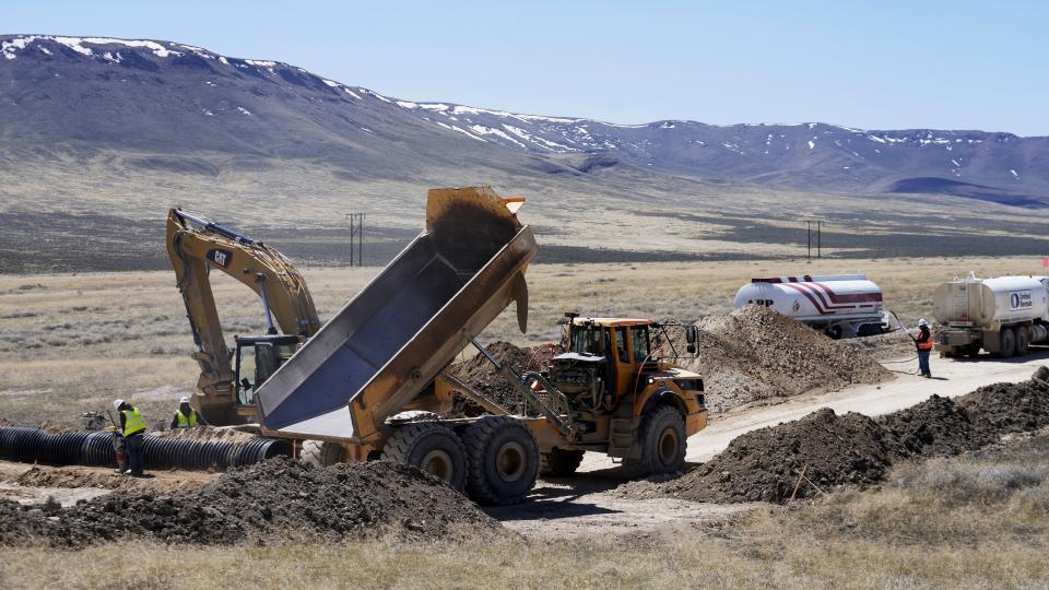 FILE - Construction continues at the Lithium Nevada Corp. mine site Thacker Pass project on April 24, 2023, near Orovada, Nev. The Reno-Sparks Indian Colony is abandoning its 3-year lawsuit aimed at blocking a lithium mine currently under construction at Thacker Pass in northwest Nevada. Tribal leaders say the U.S. Interior Department refuses to accept their arguments that the mine's on a sacred site where more than two dozen Paiute and Shoshone ancestors were massacred in 1865. (AP Photo/Rick Bowmer, File)