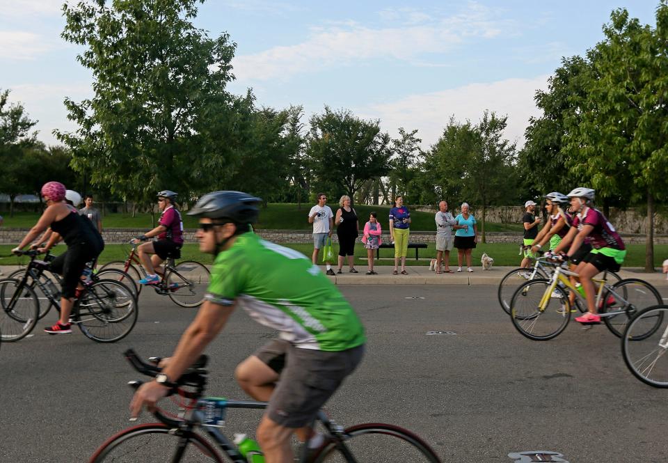 The first group of bicyclists take off from the Pelotonia start at the McFerson Commons in 2014.