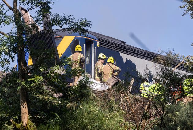 Emergency services attend the scene of a derailed train in Stonehaven, 