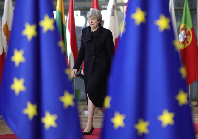 Theresa May arrives for an EU summit (Olivier Matthys/AP)