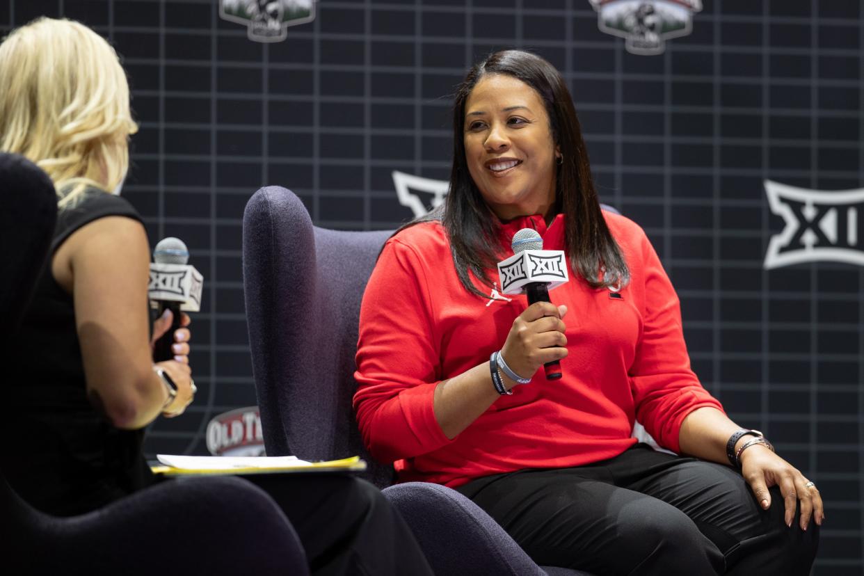 Cincinnati head coach Katrina Merriweather answers questions at the Big 12 Basketball media days, Tuesday, Oct. 17, 2023, in Kansas City, Mo.