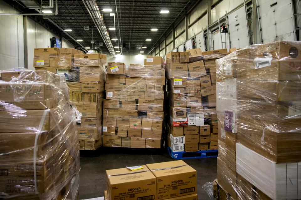 Pallets of frozen food wait to be loaded on to trucks at the Kroger's Fresh Distribution Center in Blue Ash on Tuesday, March 17, 2020. The Cincinnati Fresh Center services 105 Kroger stores in the Cincinnati, Dayton and Northern Kentucky areas. 