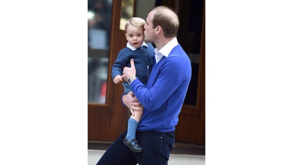 Prince William kisses Prince George