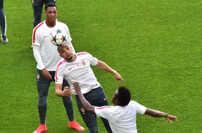 Monaco's Layvin Kurzawa (C) and Nicolas Isimat-Mirin (top) attend a training session with teammates at the Juventus Stadium in Turin, on April 13, 2015