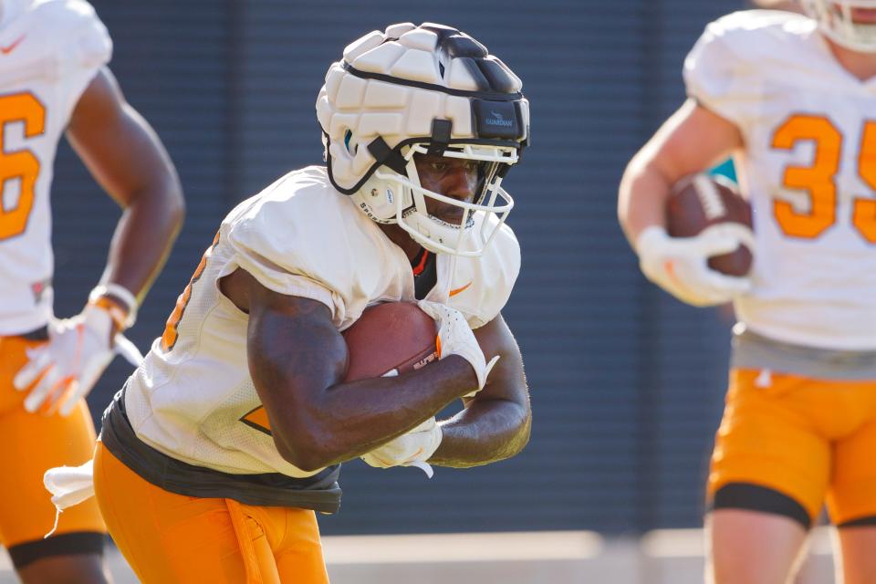 Tennessee running back Lyn-J Dixon, who previously played at Clemson, runs through a drill during preseason practice at Haslam Field in Knoxville, Tennessee.
. Photo By