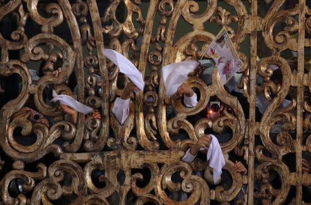 Nuns fly white towels as Pope Francis arrives to a mid-morning prayer with contemplative nuns at the Sanctuary of the Senor de los Milagros in Lima, Peru, January 21, 2018. REUTERS/Alessandro Bianchi TPX IMAGES OF THE DAY