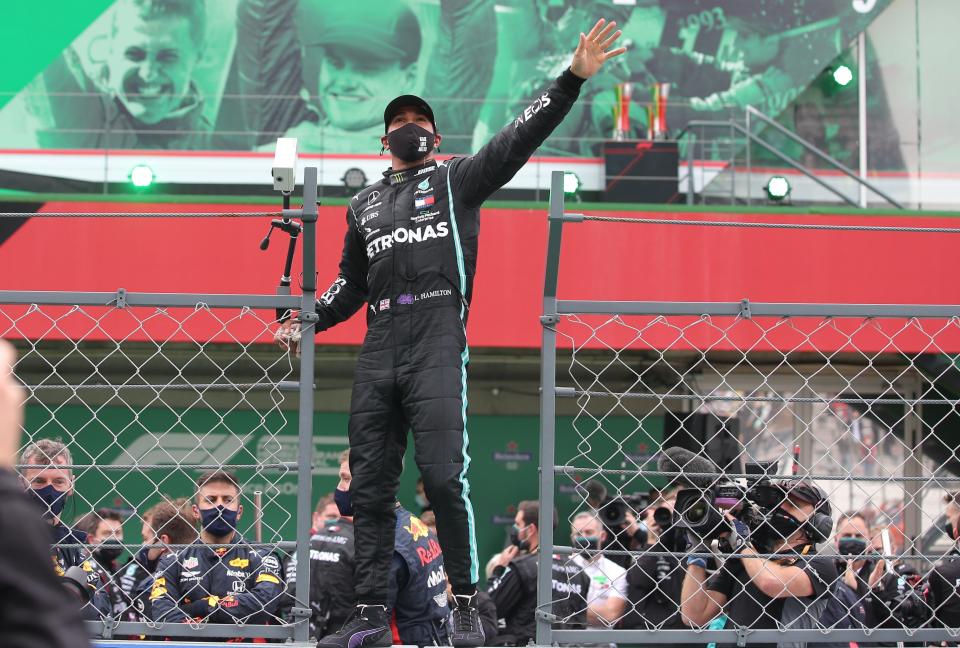 Lewis Hamilton celebrates winning the Portuguese Grand PrixReuters