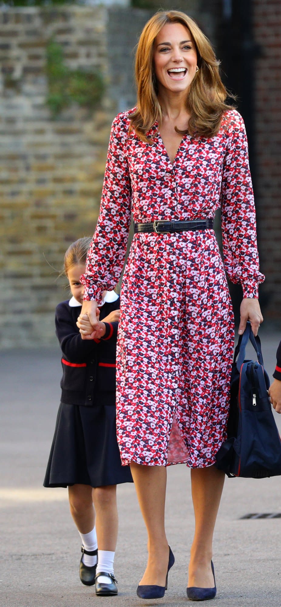 Princess Charlotte arrived <a href="https://people.com/royals/princess-charlotte-starts-school-prince-george-kate-middleton-prince-william-drop-off/" rel="nofollow noopener" target="_blank" data-ylk="slk:at her first day of school;elm:context_link;itc:0;sec:content-canvas" class="link ">at her first day of school</a> accompanied by her big brother Prince George, Kate Middleton, and Prince William. Kate wore a pink and red floral-print belted midi dress by <a href="http://www.anrdoezrs.net/links/8029122/type/dlg/sid/PEO,Shopping:EverythingYouNeedtoCopyKateMiddleton’sSummerStyle,kamiphillips2,Unc,Gal,7115494,201909,I/https://www.michaelkors.com/" rel="nofollow noopener" target="_blank" data-ylk="slk:Michael Kors;elm:context_link;itc:0;sec:content-canvas" class="link ">Michael Kors</a> (the same dress she wore to Meghan and Harry’s wedding rehearsal!), pumps, and her signature bouncy blowout. <strong>Get the Look!</strong> Fashion Union Petite Midi Tea Dress in Floral, $56; <a href="https://click.linksynergy.com/deeplink?id=93xLBvPhAeE&mid=35719&murl=https%3A%2F%2Fus.asos.com%2Ffashion-union-petite%2Ffashion-union-petite-midi-tea-dress-in-floral%2Fprd%2F12250904&u1=PEO%2CShopping%3AEverythingYouNeedtoCopyKateMiddleton%E2%80%99sSummerStyle%2Ckamiphillips2%2CUnc%2CGal%2C7115494%2C201909%2CI" rel="nofollow noopener" target="_blank" data-ylk="slk:asos.com;elm:context_link;itc:0;sec:content-canvas" class="link ">asos.com</a> French Connection Cerisier Botanical-Print Midi Dress, $118; <a href="https://click.linksynergy.com/deeplink?id=93xLBvPhAeE&mid=13867&murl=https%3A%2F%2Fwww.bloomingdales.com%2Fshop%2Fproduct%2Ffrench-connection-cerisier-botanical-print-midi-dress%3FID%3D3359704&u1=PEO%2CShopping%3AEverythingYouNeedtoCopyKateMiddleton%E2%80%99sSummerStyle%2Ckamiphillips2%2CUnc%2CGal%2C7115494%2C201909%2CI" rel="nofollow noopener" target="_blank" data-ylk="slk:bloomingdales.com;elm:context_link;itc:0;sec:content-canvas" class="link ">bloomingdales.com</a> La Maison Talulah Daiquiri Midi Dress, $96; <a href="https://www.amazon.com/Maison-Talulah-Womens-Daiquiri-Strawberry/dp/B07N1Q6VKQ/ref=as_li_ss_tl?keywords=la+maison+talulah+red+floral+dress&qid=1567690794&s=gateway&sr=8-1&linkCode=ll1&tag=poamzfkatemiddletonstylekphillips0919-20&linkId=39ff0a2460f8ba923ab41d0ac45a771e&language=en_US" rel="nofollow noopener" target="_blank" data-ylk="slk:amazon.com;elm:context_link;itc:0;sec:content-canvas" class="link ">amazon.com</a> True Violet Exclusive Long Sleeve Wrap Front Midaxi Dress in Red Floral, $156; <a href="https://click.linksynergy.com/deeplink?id=93xLBvPhAeE&mid=35719&murl=https%3A%2F%2Fus.asos.com%2Ftrue-violet%2Ftrue-violet-exclusive-long-sleeve-wrap-front-midaxi-dress-in-red-floral%2Fprd%2F12639639&u1=PEO%2CShopping%3AEverythingYouNeedtoCopyKateMiddleton%E2%80%99sSummerStyle%2Ckamiphillips2%2CUnc%2CGal%2C7115494%2C201909%2CI" rel="nofollow noopener" target="_blank" data-ylk="slk:asos.com;elm:context_link;itc:0;sec:content-canvas" class="link ">asos.com</a> Fame and Partners Evelyn Floral Wrap Dress, $279; <a href="https://click.linksynergy.com/deeplink?id=93xLBvPhAeE&mid=13867&murl=https%3A%2F%2Fwww.bloomingdales.com%2Fshop%2Fproduct%2Ffame-partners-evelyn-floral-wrap-dress%3FID%3D3367074&u1=PEO%2CShopping%3AEverythingYouNeedtoCopyKateMiddleton%E2%80%99sSummerStyle%2Ckamiphillips2%2CUnc%2CGal%2C7115494%2C201909%2CI" rel="nofollow noopener" target="_blank" data-ylk="slk:bloomingdales.com;elm:context_link;itc:0;sec:content-canvas" class="link ">bloomingdales.com</a> Saloni Yasmeen Floral Long Sleeve Silk Midi Dress, $695; <a href="https://click.linksynergy.com/deeplink?id=93xLBvPhAeE&mid=1237&murl=https%3A%2F%2Fshop.nordstrom.com%2Fs%2Fsaloni-yasmeen-floral-long-sleeve-silk-midi-dress%2F5226454&u1=PEO%2CShopping%3AEverythingYouNeedtoCopyKateMiddleton%E2%80%99sSummerStyle%2Ckamiphillips2%2CUnc%2CGal%2C7115494%2C201909%2CI" rel="nofollow noopener" target="_blank" data-ylk="slk:nordstrom.com;elm:context_link;itc:0;sec:content-canvas" class="link ">nordstrom.com</a> Nanette Nanette Lepore Pintucked Floral-Print Shirt Dress, $128; <a href="https://click.linksynergy.com/deeplink?id=93xLBvPhAeE&mid=13867&murl=https%3A%2F%2Fwww.bloomingdales.com%2Fshop%2Fproduct%2Fnanette-nanette-lepore-pintucked-floral-print-shirt-dress%3FID%3D3451686&u1=PEO%2CShopping%3AEverythingYouNeedtoCopyKateMiddleton%E2%80%99sSummerStyle%2Ckamiphillips2%2CUnc%2CGal%2C7115494%2C201909%2CI" rel="nofollow noopener" target="_blank" data-ylk="slk:bloomingdales.com;elm:context_link;itc:0;sec:content-canvas" class="link ">bloomingdales.com</a>