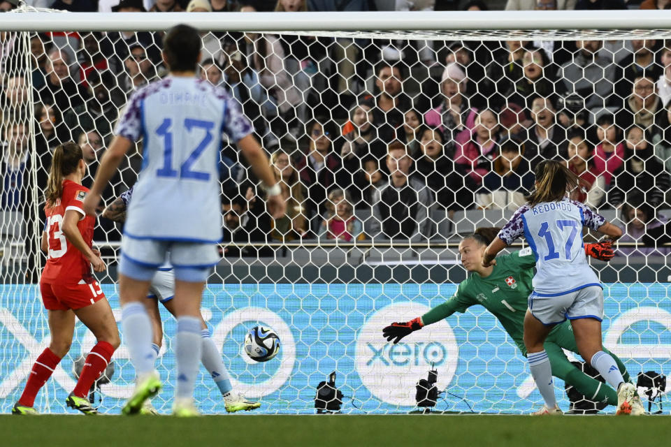 Spain's Alba Redondo puts the ball past Switzerland's goalkeeper Gaelle Thalmann to score her team's second goal during the Women's World Cup second round soccer match between Switzerland and Spain at Eden Park in Auckland, New Zealand, Saturday, Aug. 5, 2023. (AP Photo/Andrew Cornaga)