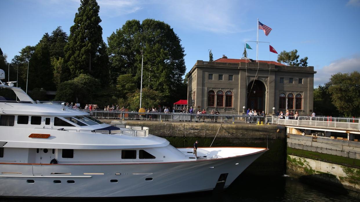<div>People watch boats pass through the Hiram M. Chittenden Ballard Locks during a holiday weekend celebration held in honor of the Locks' Centennial anniversary, July 3, 2017.</div> <strong>(GENNA MARTIN/San Francisco Chronicle via Getty Images)</strong>