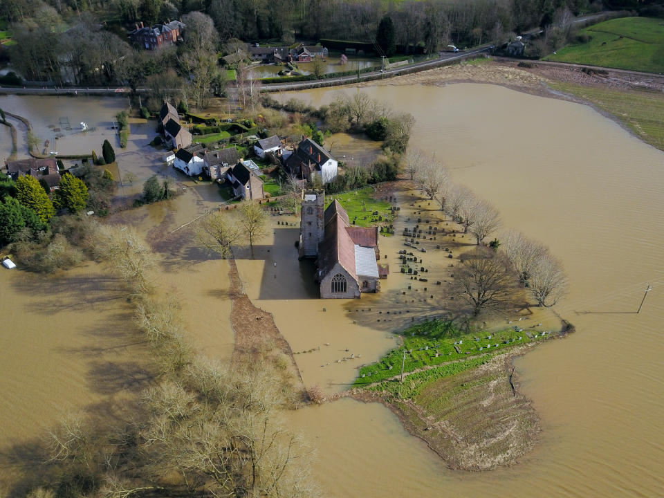 Barriers put up in the town of Ironbridge are struggling to hold back the water, with some seeping underneath.