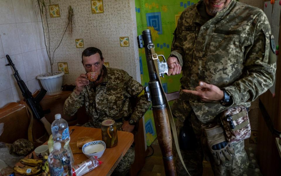 A Ukrainian Territorial Defence Force member shows his weapon in Kharkiv  - Bernat Armangue /AP