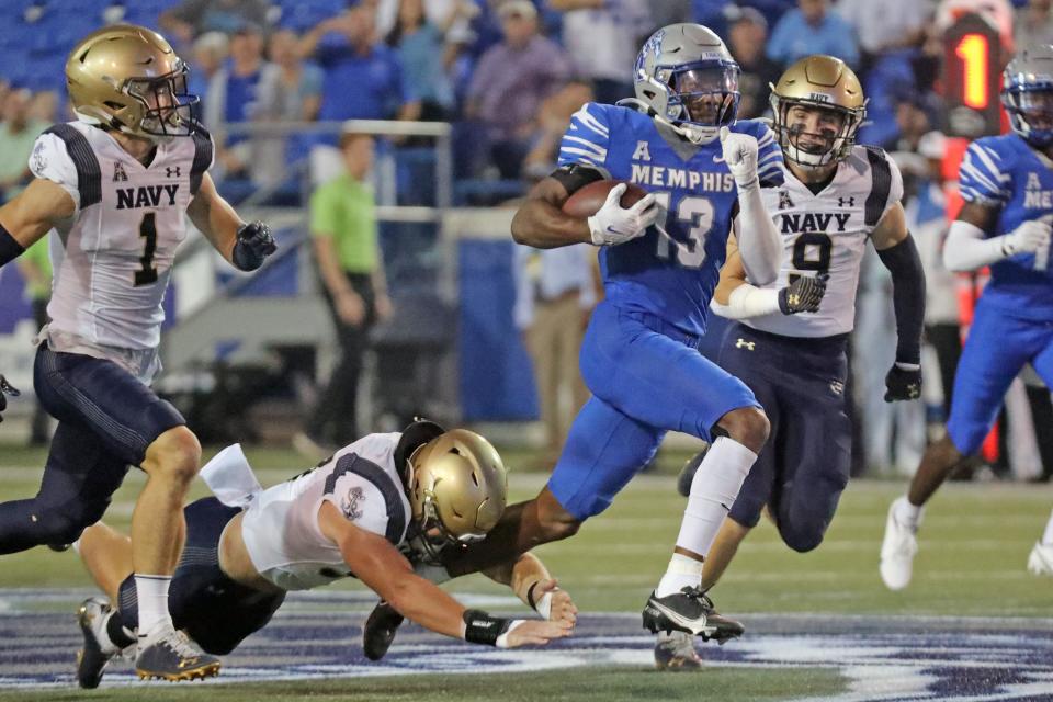 Oct 14, 2021; Memphis, Tennessee, USA; Memphis Tigers wide receiver Javon Ivory (13) runs after catch for a big gain during the first half against the Navy Midshipmen at Liberty Bowl Memorial Stadium. Mandatory Credit: Petre Thomas-USA TODAY Sports