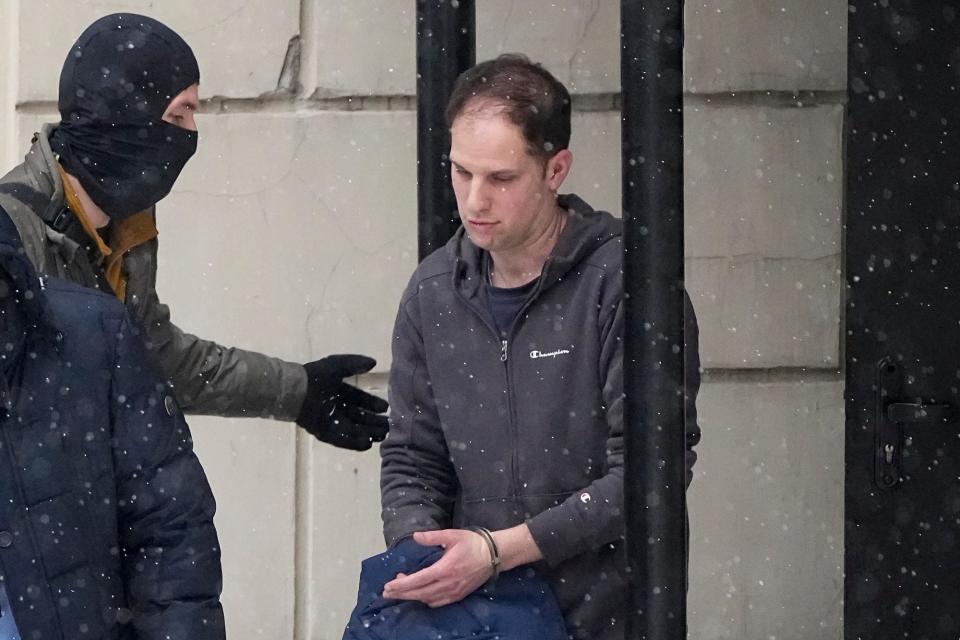 Wall Street Journal reporter Evan Gershkovich is escorted from court after a hearing in Moscow