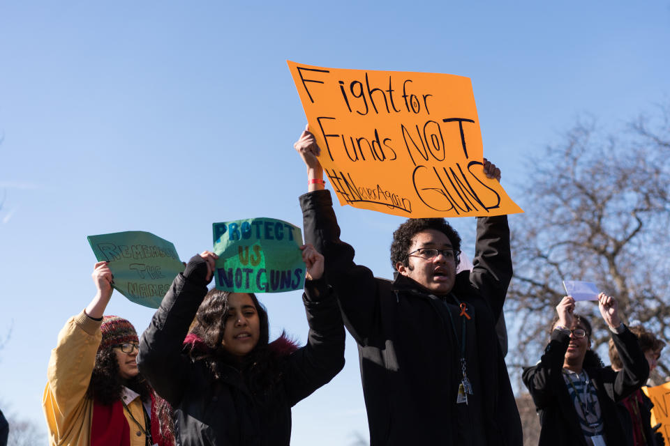 Students at Lane Technical High School in Chicago held signs in support of the walkout.