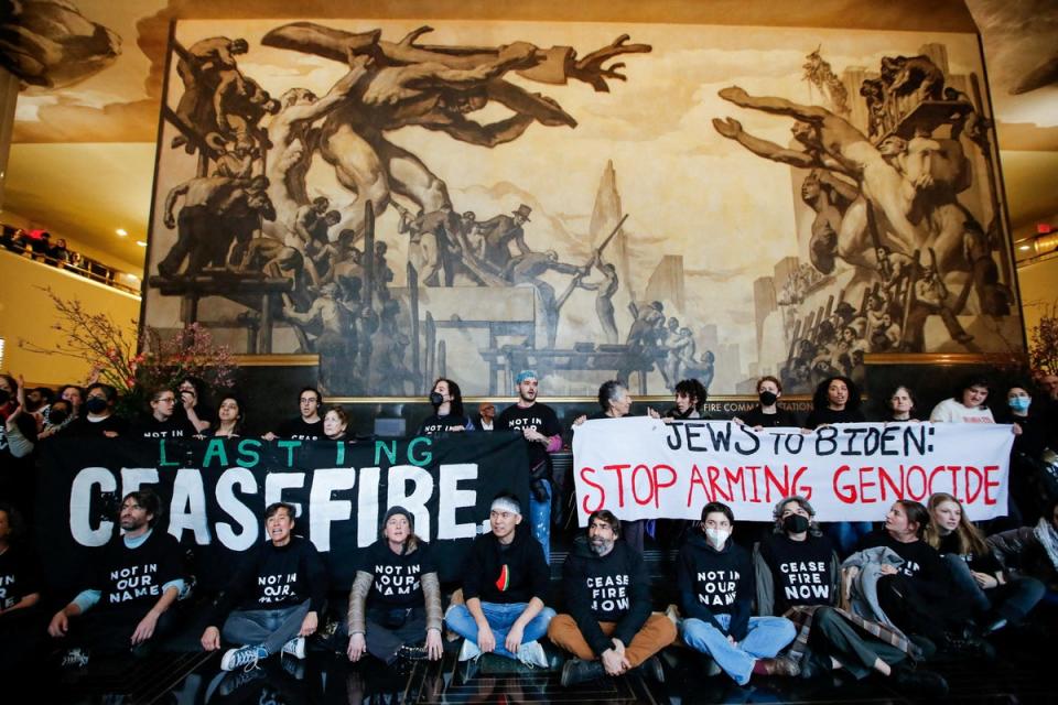 Demonstrators protest inside the Rockefeller Center asking for a ceasefire in the ongoing conflict between Israel and the Palestinian Islamist group Hamas (REUTERS)