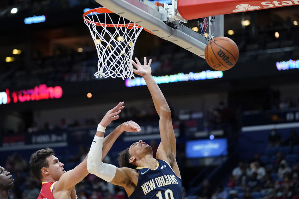 New Orleans Pelicans center Jaxson Hayes (10) battles under the basket against Atlanta Hawks forward Danilo Gallinari in the second half of an NBA basketball game in New Orleans, Wednesday, Oct. 27, 2021. The Hawks won 102-99. (AP Photo/Gerald Herbert)