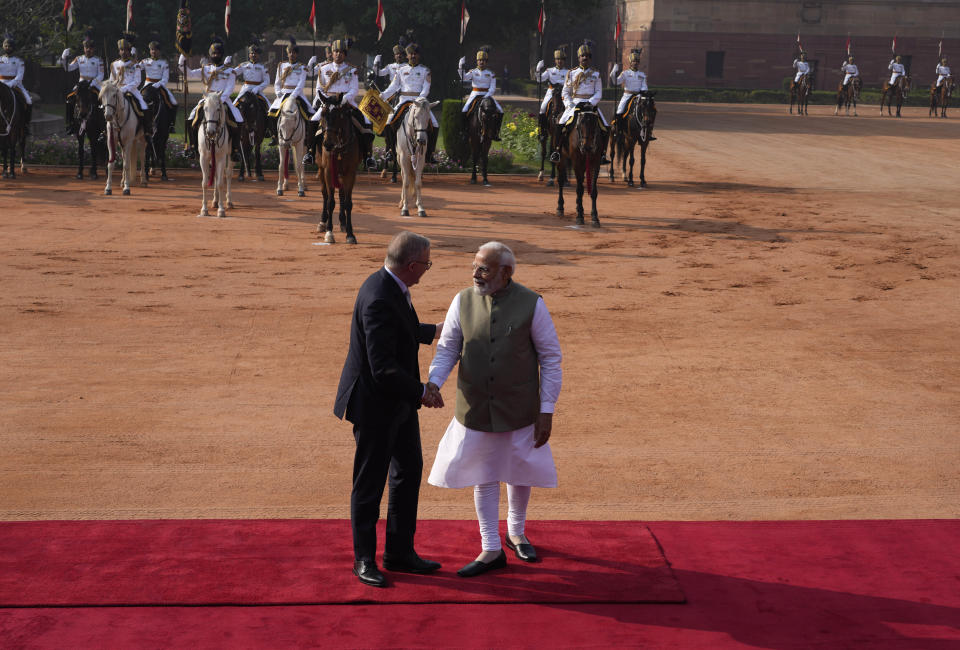 Indian Prime Minister Narendra Modi welcomes his Australian counterpart Anthony Albanese during laters's ceremonial reception at the Indian presidential palace, in New Delhi, India, Friday, March 10, 2023. Australia is striving to strengthen security cooperation with India and also deepen economic and cultural ties, Prime Minister Anthony Albanese said on Friday. (AP Photo/Manish Swarup)