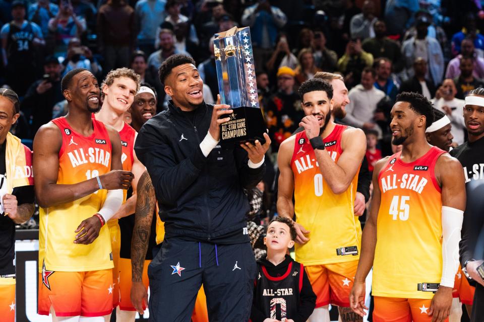 Milwaukee Bucks forward Giannis Antetokounmpo raises the 2023 All-Star victory trophy during the NBA All-Star game in Salt Lake City on Feb. 19, 2023. | Ryan Sun, Deseret News