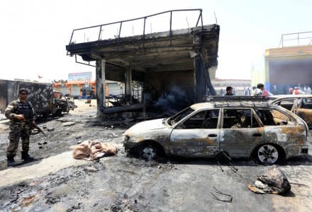 Afghan security forces inspect the site of a suicide attack in Jalalabad city, Afghanistan July 10, 2018. REUTERS/Parwiz