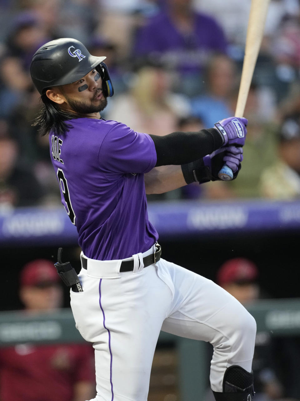 Colorado Rockies' Connor Joe watches his three-run triple off Arizona Diamondbacks starting pitcher Dallas Keuchel during the fourth inning of a baseball game Saturday, July 2, 2022, in Denver. (AP Photo/David Zalubowski)