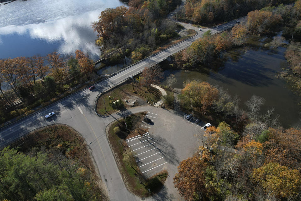 The Miller Park Boat Launch on the Androscoggin River, is shown on Tuesday, Oct. 31, 2023, in Lisbon, Maine. This is where authorities found the Army reservist, Robert Card's, vehicle after he shot and killed 18 people at a bowling alley and then a bar and grille in Lewiston. His body was found at the Maine Recycling Corporation, about 8 miles southeast of where the second shooting occurred on Wednesday, Oct. 25. (AP Photo/Jessie Wardarski)