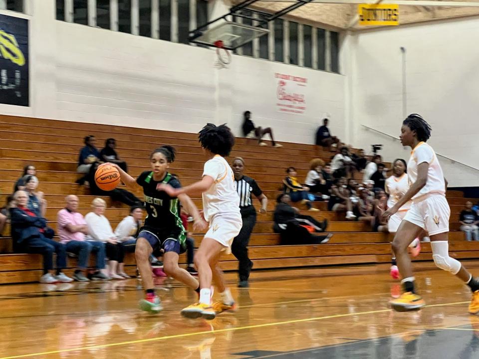 Haines City's Arissa Jenkins drives right in the Class 7A , District 9 title game vs. Winter Have. She scored 18 in the game.