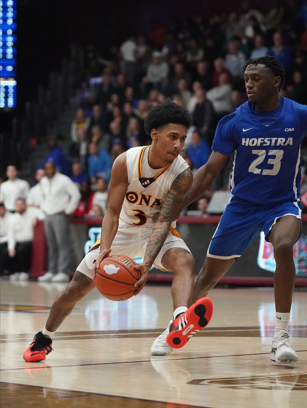 Iona guard Jeremiah Quigley (3) drives on Hofstra guard Tyler Thomas (23) during NCAA mens basketball action at Iona University in New Rochelle on Wednesday, Dec 6, 2023.