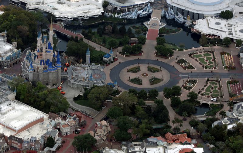 FILE PHOTO: Disney's Magic Kingdom theme park sits empty after it closed in an effort to combat the spread of coronavirus disease (COVID-19) in Orlando