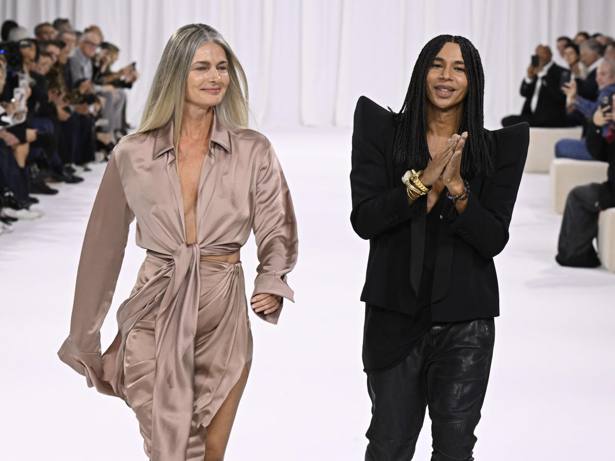 PARIS, FRANCE - SEPTEMBER 25: (EDITORIAL USE ONLY - For Non-Editorial use please seek approval from Fashion House) Model Paulina Porizkova and designer Olivier Rousteing (R) walk the runway during the Balmain Womenswear Spring-Summer 2025 show as part of Paris Fashion Week on September 25, 2024 in Paris, France. (Photo by Kristy Sparow/Getty Images)