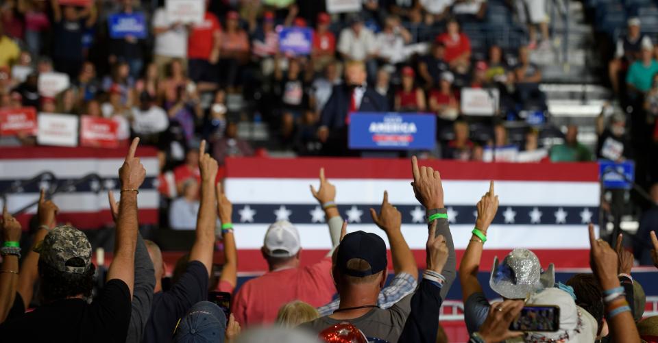 Donald Trump supporters held their index fingers in the air during a rally in Youngstown, Ohio, on Sept. 17, where Trump spoke in support of Republican candidates running for state and federal offices.