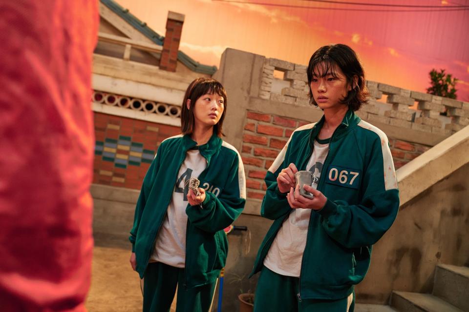 HoYeon standing next to each other in a scene from the show