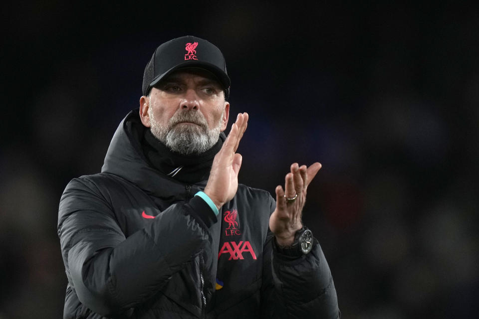 Liverpool's manager Jurgen Klopp applauds supporters at the end of the English Premier League soccer match between Crystal Palace and Liverpool at Selhurst Park, in London, Saturday, Feb. 25, 2023. (AP Photo/Alastair Grant)