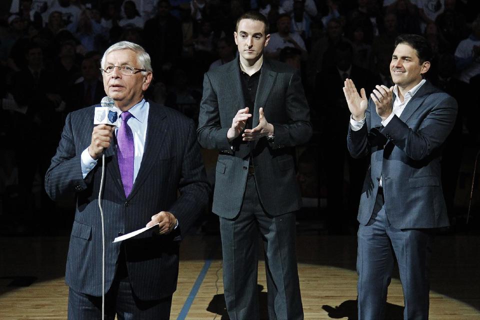 NBA Commissioner David Stern, left, introduces new Memphis Grizzlies chairman Robert J. Pera, center, and new CEO Jason Levien to fans during a ceremony at the Grizzlies' opening night NBA basketball game against the Utaz Jazz in Memphis, Tenn., Monday, Nov. 5, 2012. (AP Photo/Lance Murphey)