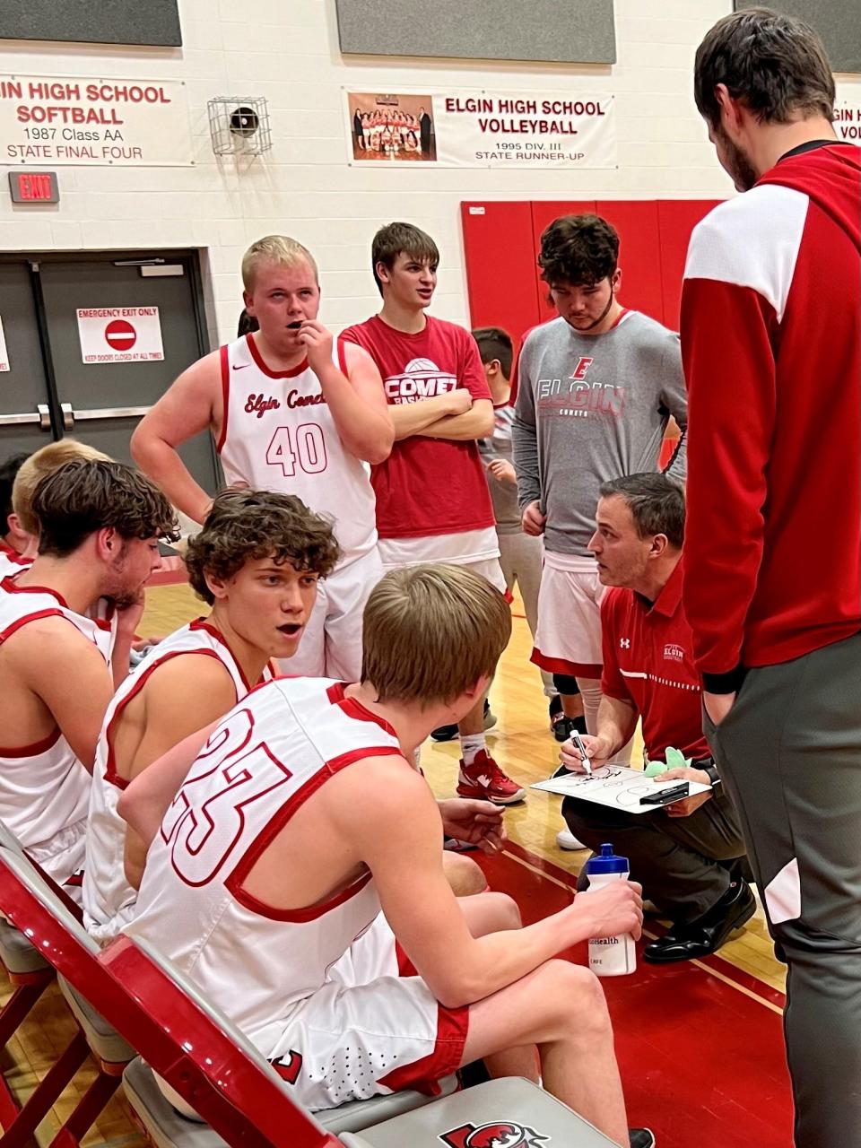 Elgin boys basketball coach Bill Clem talks to his team during a timeout Friday night in a Northwest Central Conference game with Upper Scioto Valley.